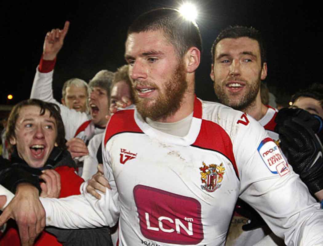Walking off the pitch surrounded by pitch invaders after beating Newcastle