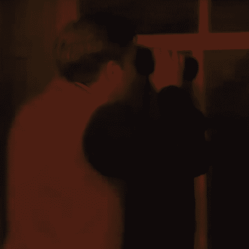 Father Dougal at the window