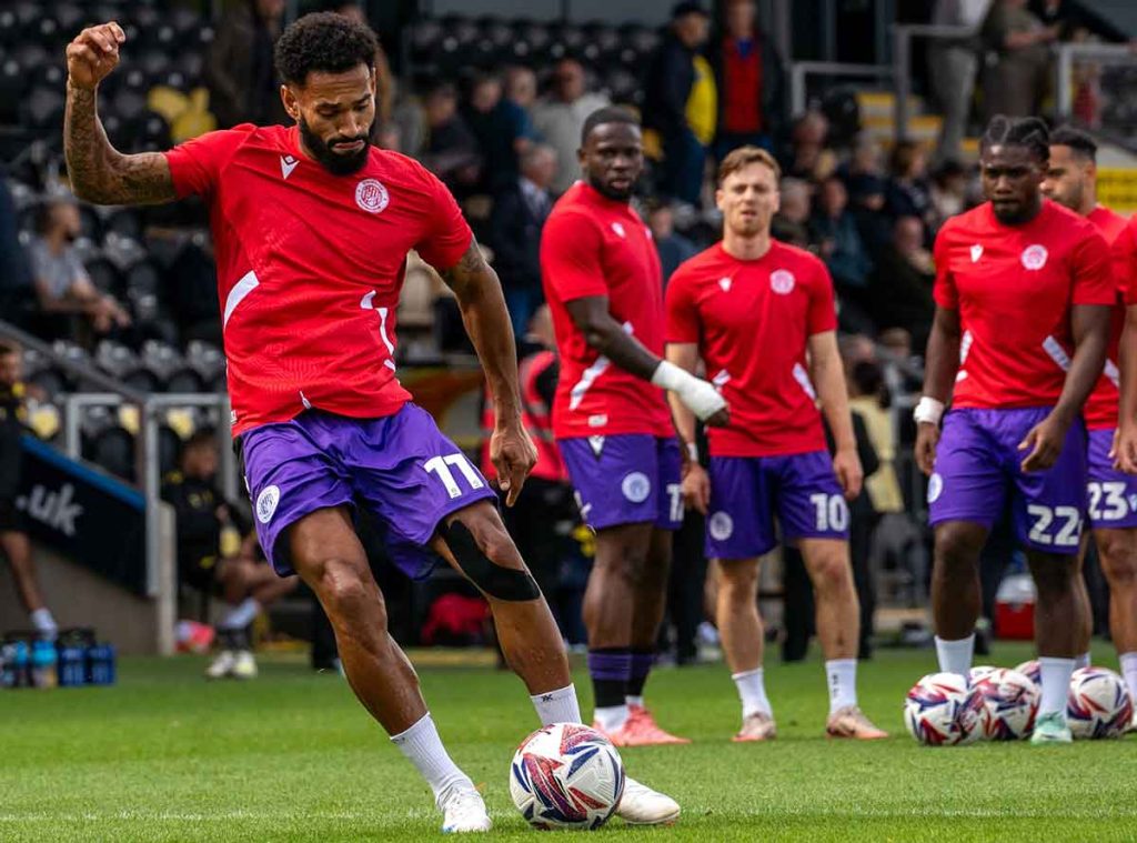 Jordan Roberts shoots at goal in a pre-match warm-up drill